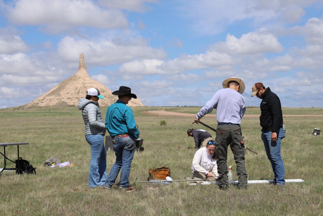 A Nebraska soil health research team collecting reference-site samples in native grassland near Chimney Rock.
