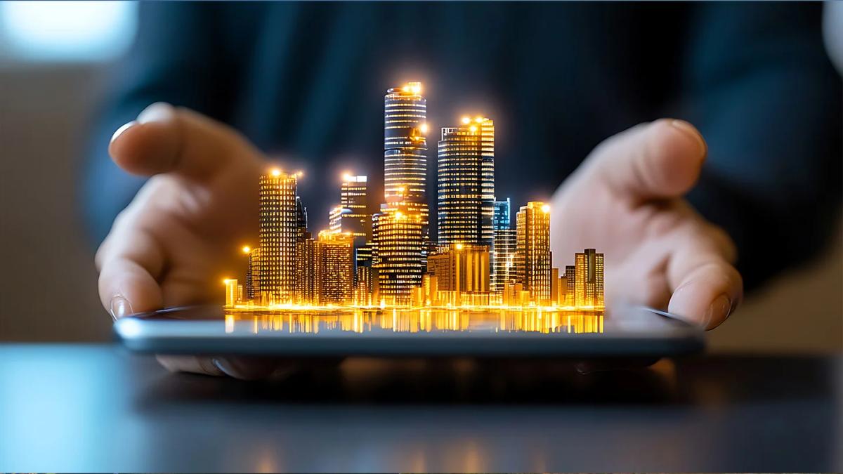 Hands holding a digital cityscape model with illuminated high-rise buildings, representing smart real estate development.