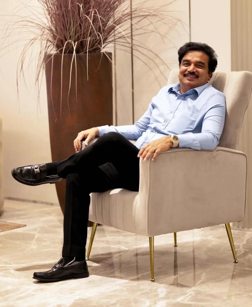 Dr. G.V. Rao, Founder and Chairman of SAS Infra, seated in a modern office lounge.