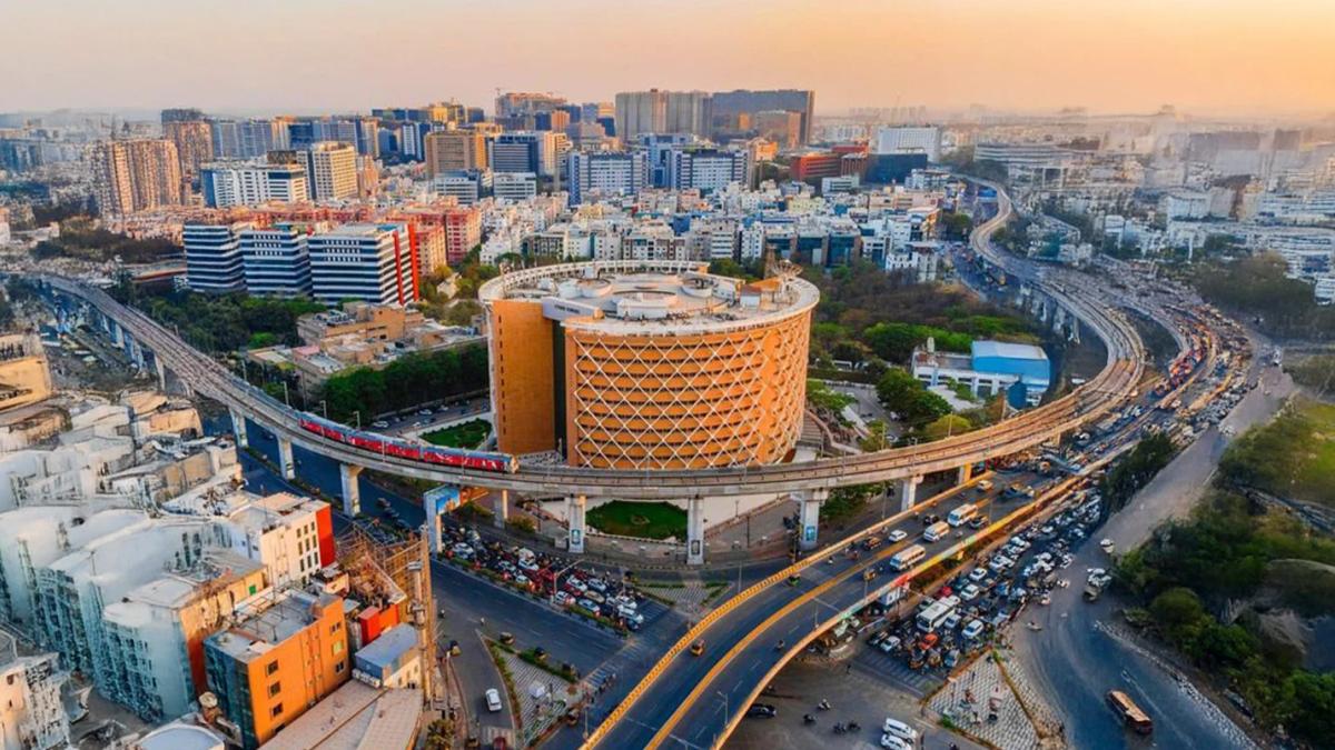 Aerial view of Hyderabad city showcasing modern infrastructure, metro lines, and commercial development.