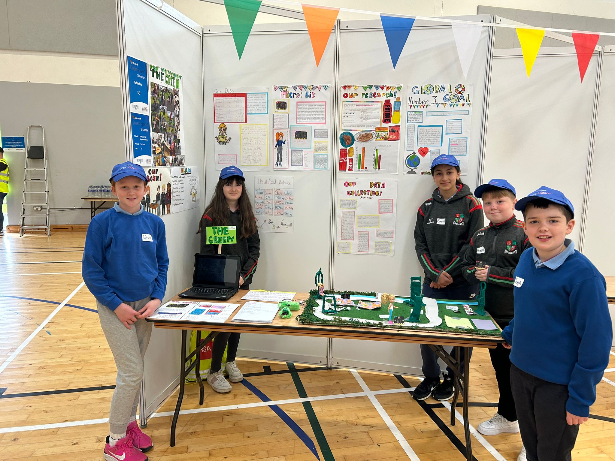Students standing next to a prototype of The Green