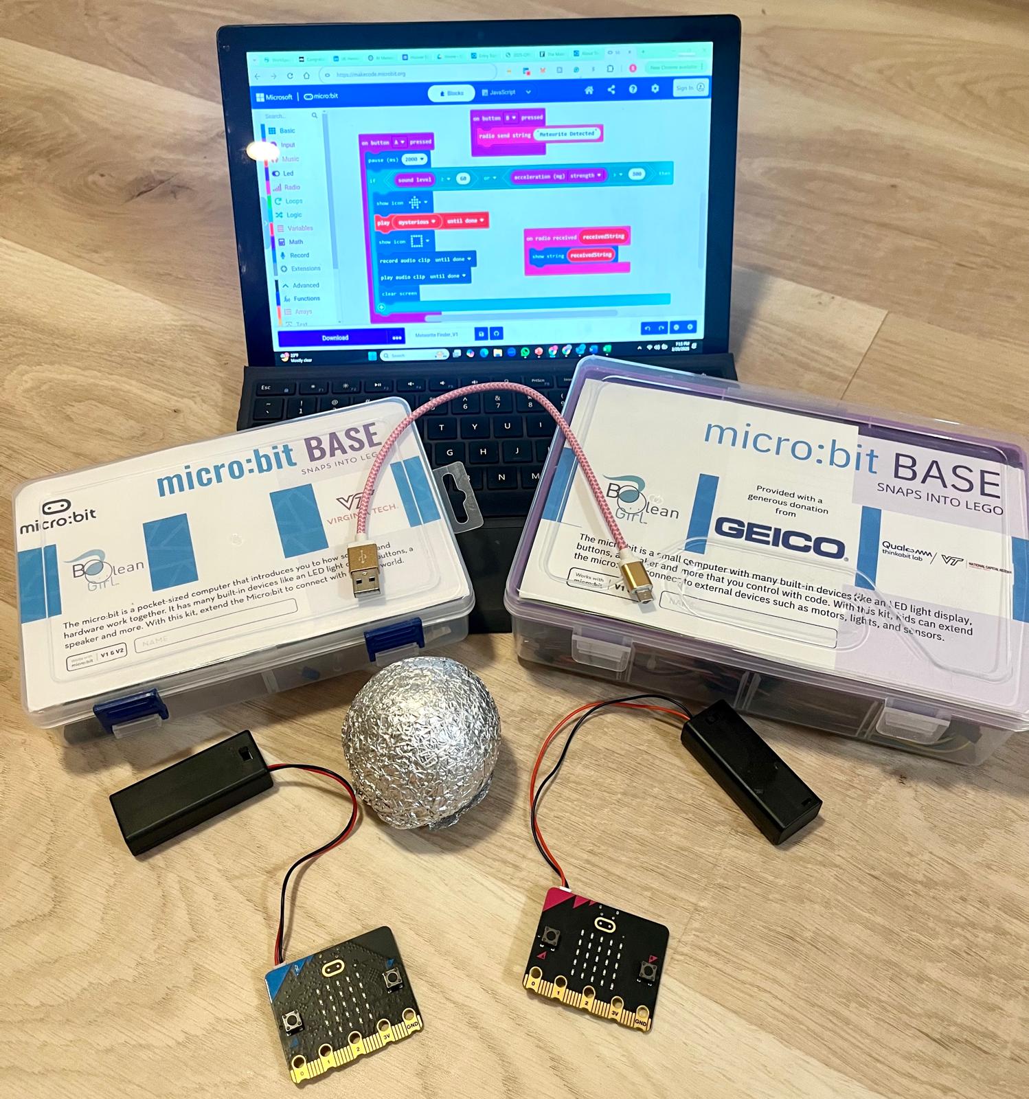 Image shows a computer with project code and two micro:bits.