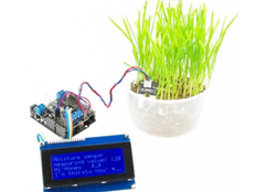 Image shows the prototype of the AM Blue Sensor and includes a plant connected to a micro:bit.