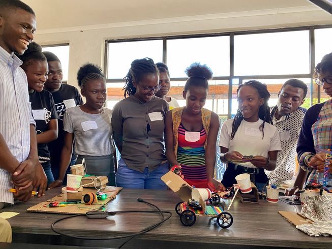 Students in Malawi presenting their invention