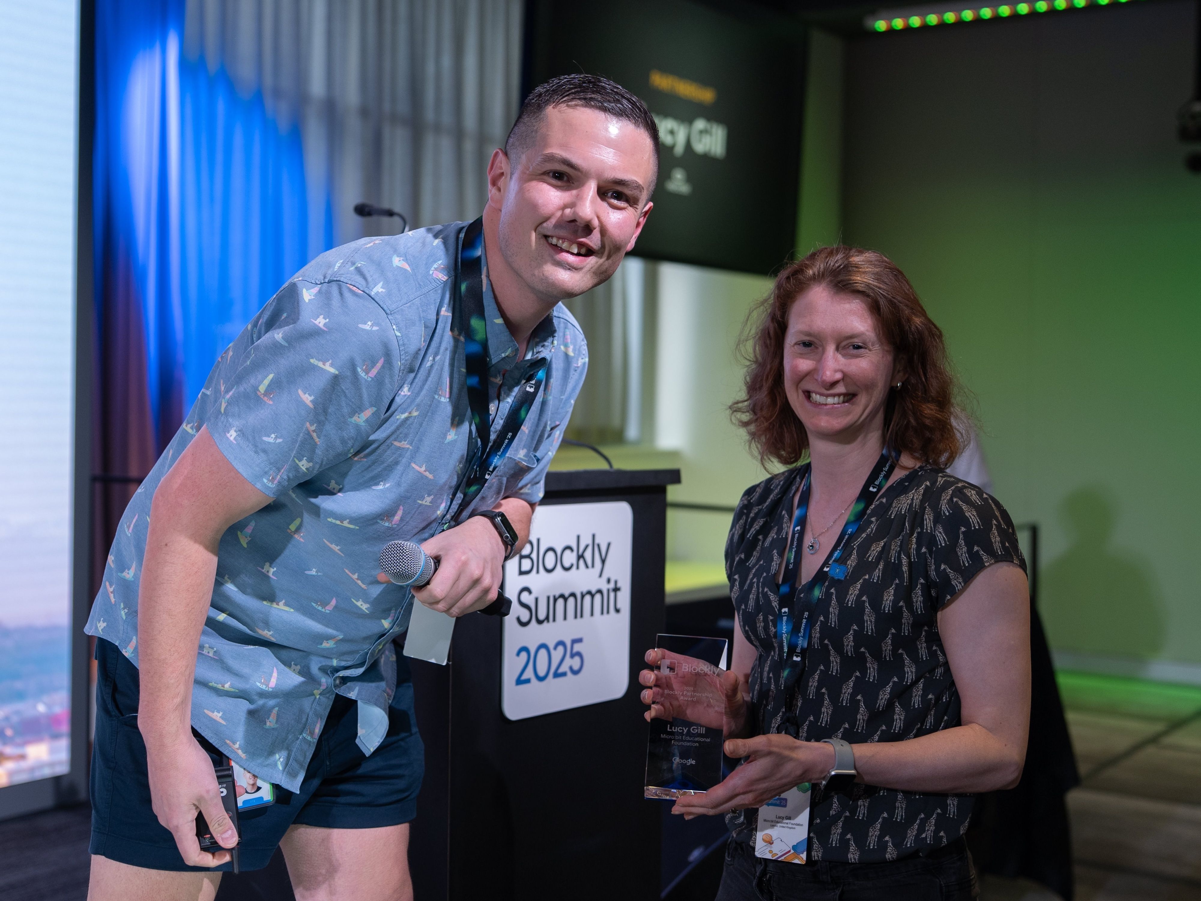 Lucy Gill receiving the Blockly Partnership Award from Joe Davis (Google) at the Blockly Summit 2025