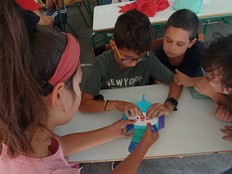 Students working together to build a micro:bit animal.