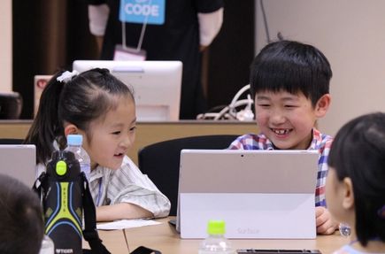 two Japanese children collaborating