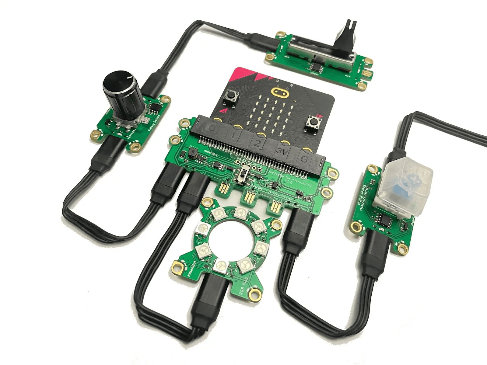 A Jacdac breakout board with a micro:bit attached, and a range of external components all connected via Jacdac cables. 