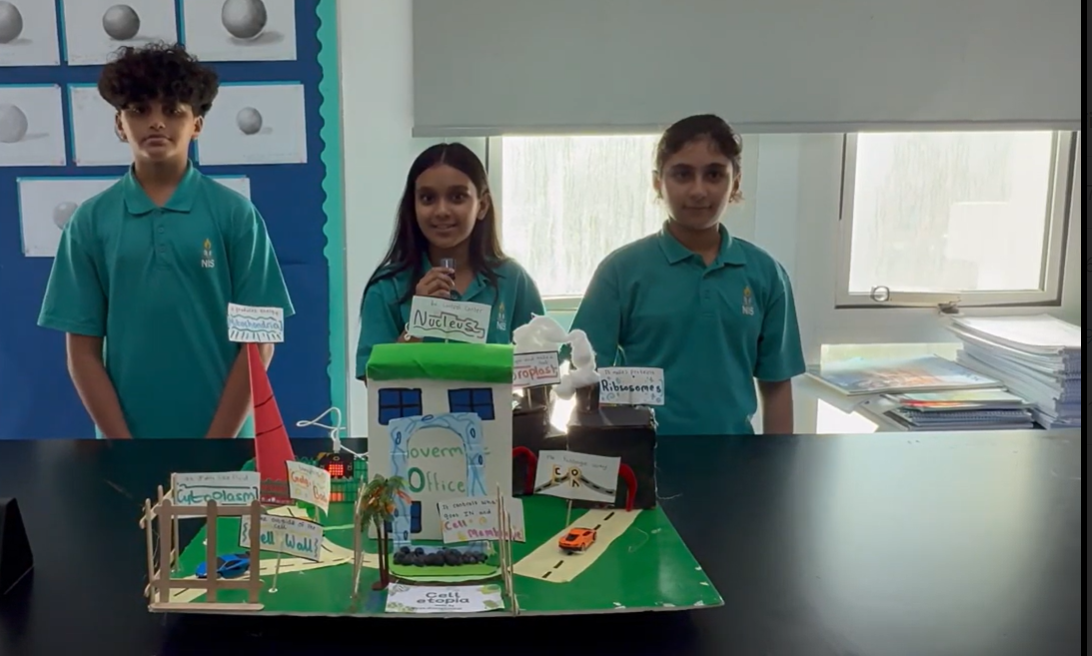 Students present the prototype of the cell city. 