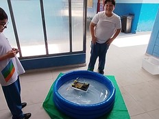 Students pose with a prototype of their project.