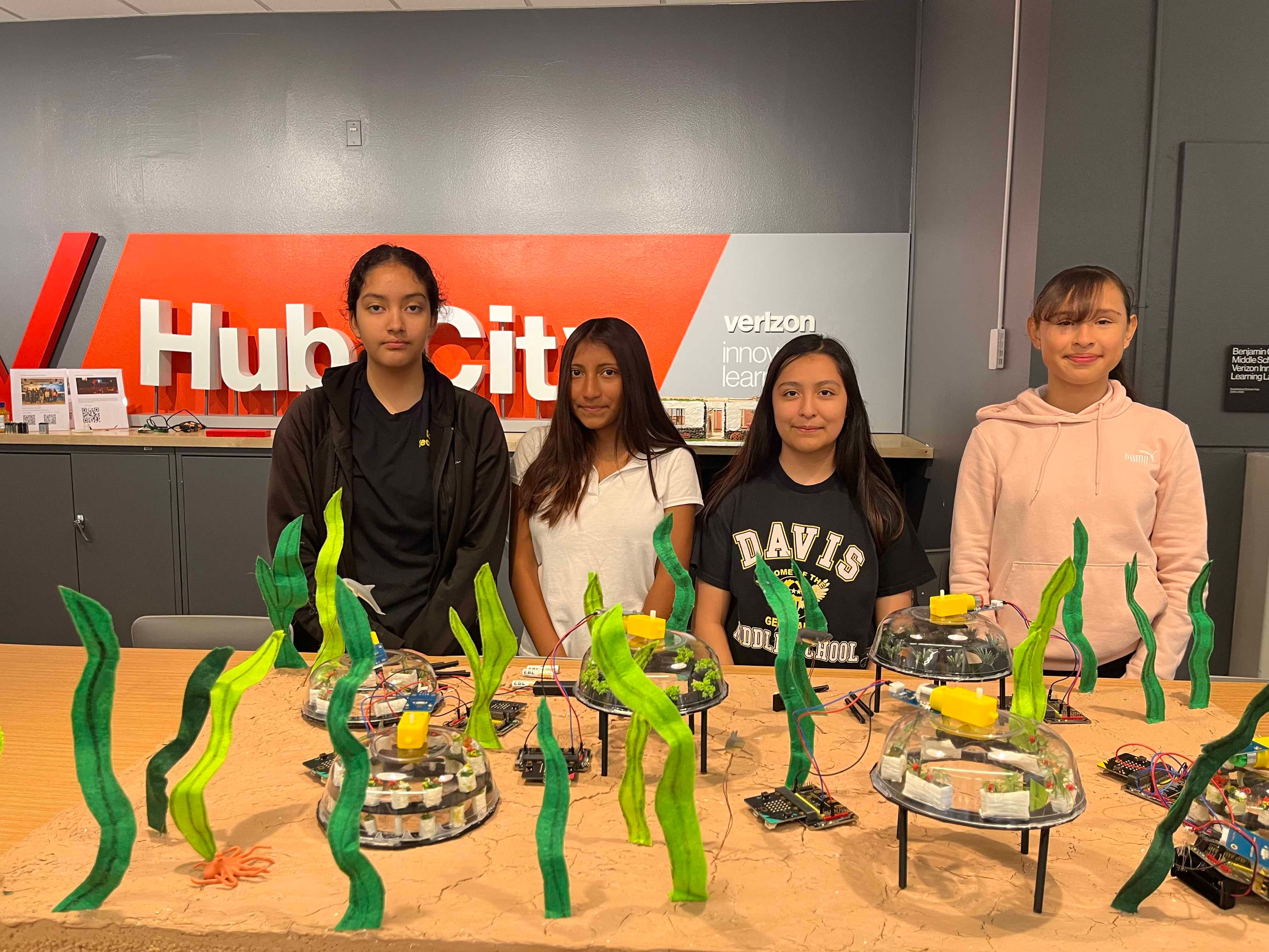 Students pose with the Regenerative Ocean Farm prototype.