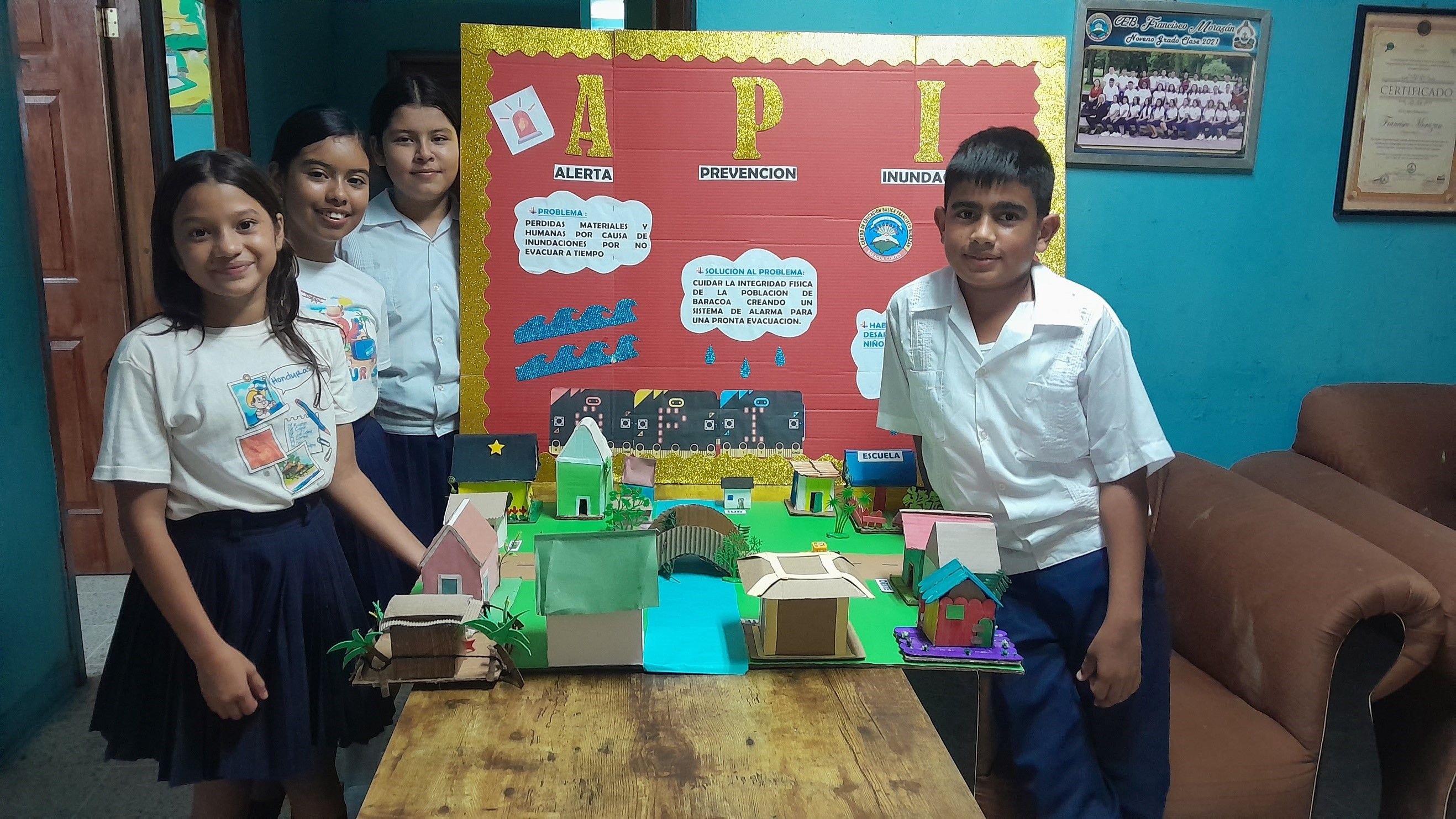 Students pose with the API prototype and project board.