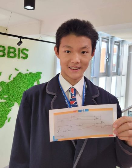 Qingzhe presents his design for his micro:bit creation.