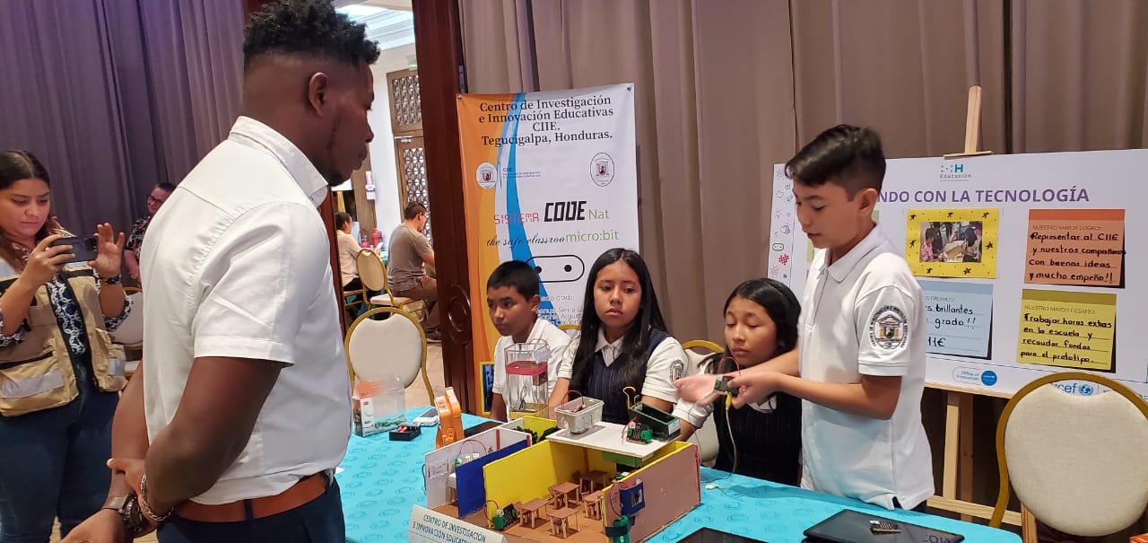 Students presenting the CODEnat System at a local competition.