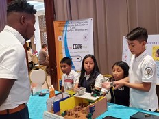 Students presenting the CODEnat System at a local competition.