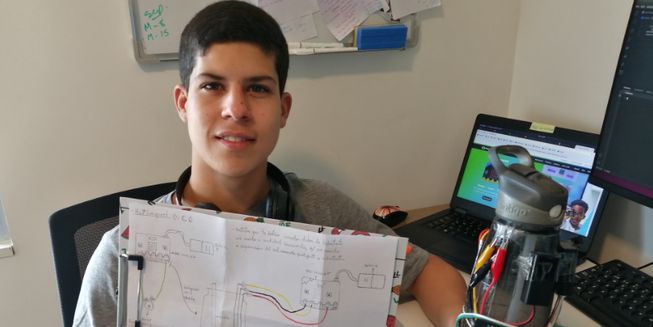 Sebastian with his design for the smart water bottle. 