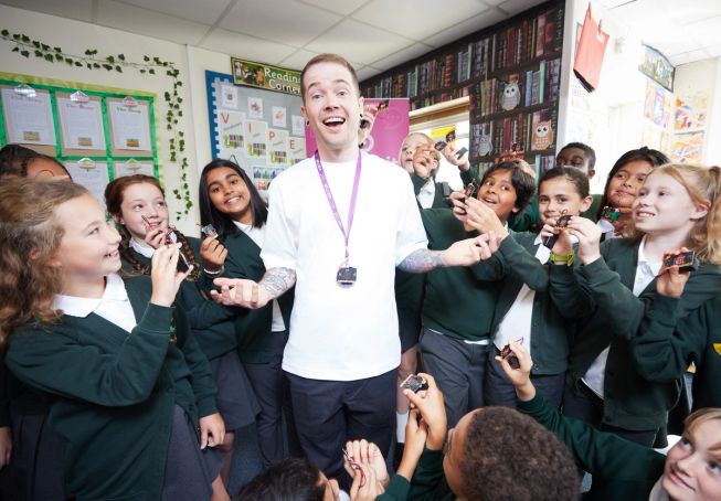 Influencer DanTDM with children from a UK primary school