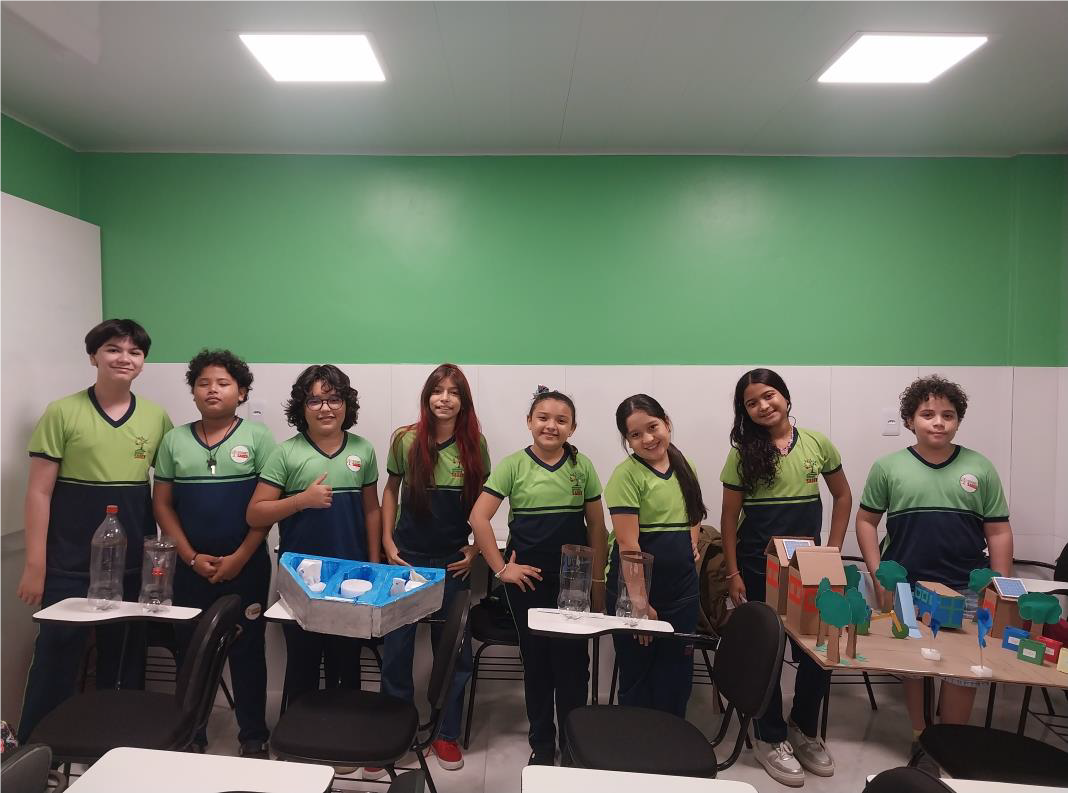 Students pose with the prototype of their project.