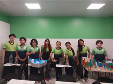 Students pose with the prototype of their project.