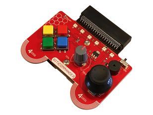 Bit:Commander, a red handheld game controller board with 4 buttons, a joystick and dial. There is a slot at the top of the board where a micro:bit can be mounted.