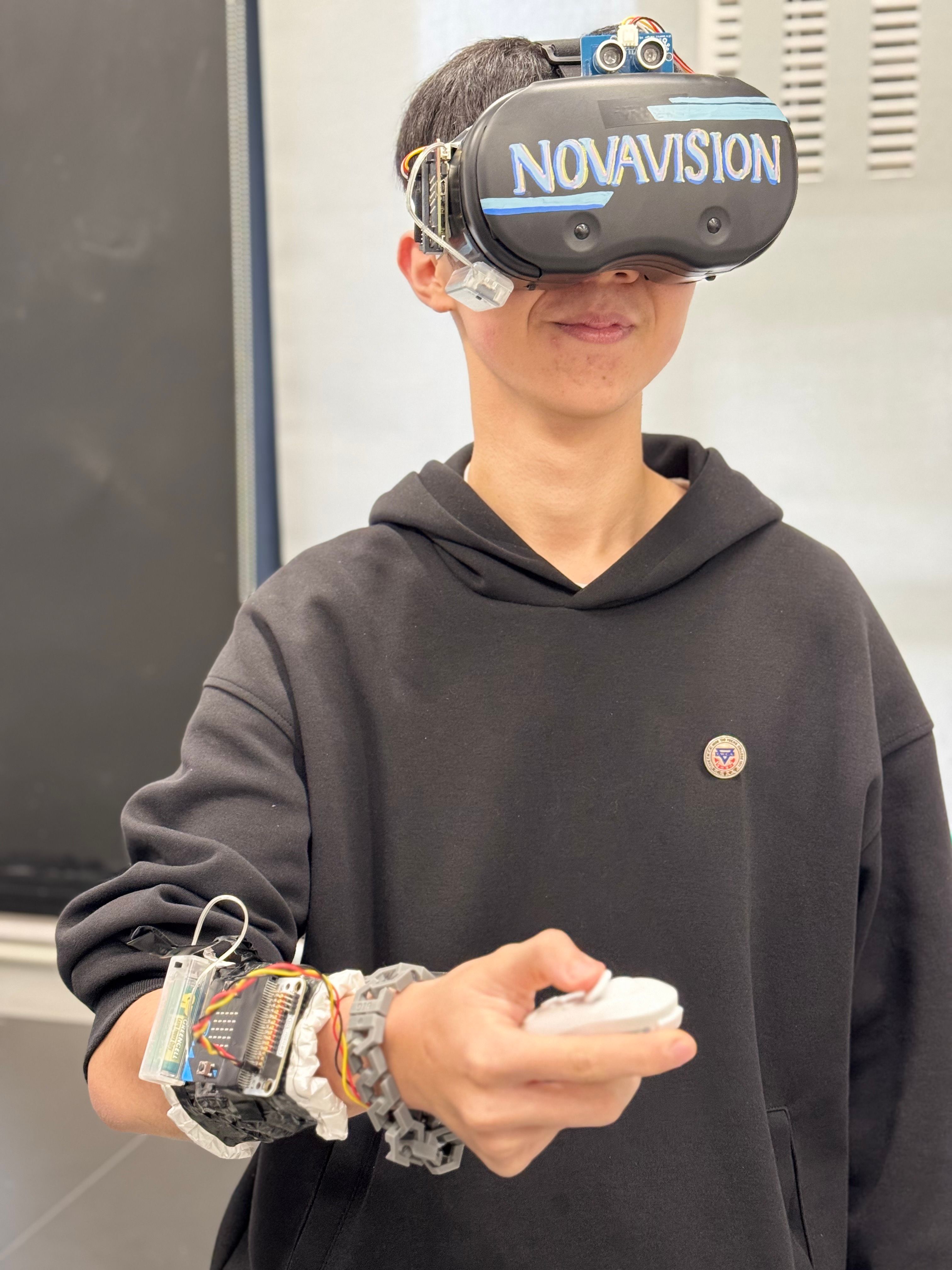 Student wears the Novavision device and demonstrates how it works. 