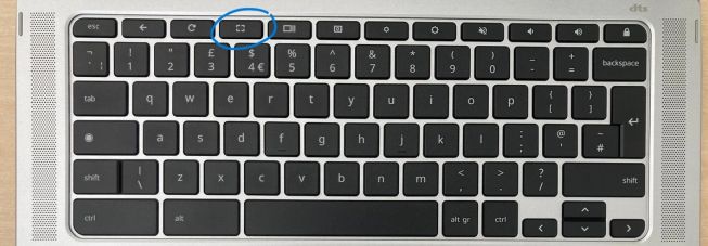 A photo of the Chromebook keyboard with the fullscreen key on the top row circled.