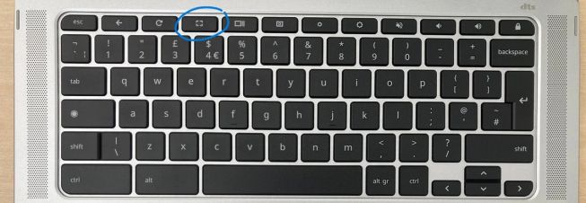 A photo of the Chromebook keyboard with the fullscreen key on the top row circled.