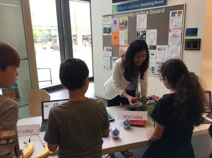 A teacher demonstrating micro:bit to pupils