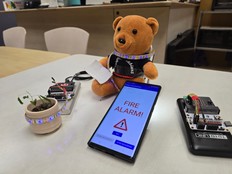 A Teddy bear and smart phone demonstrate how the "Wish to Hear the Sound" prototype works.