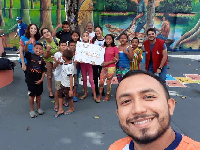 a group of Brazilian children with their teacher