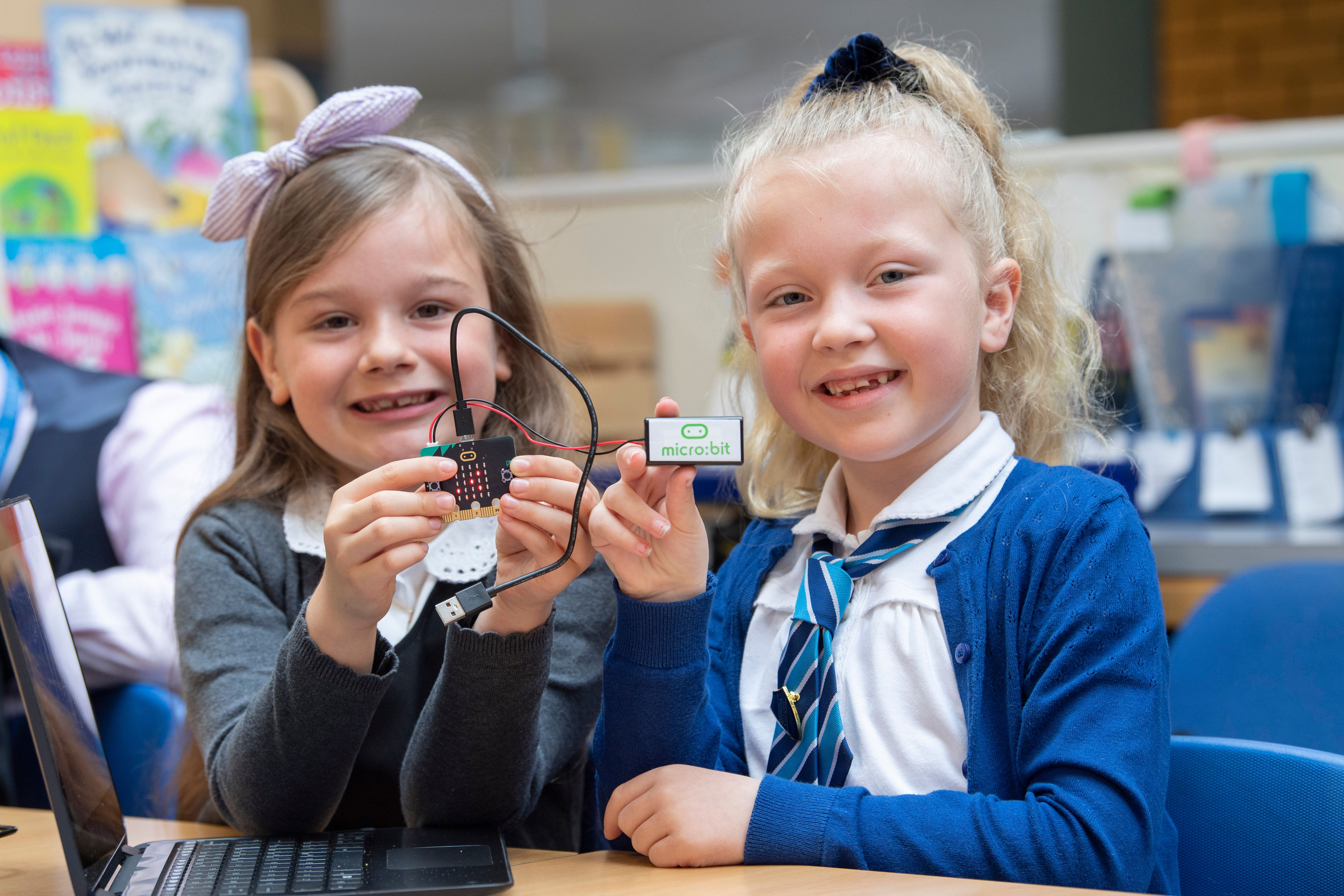 Pupils at Methilhill Primary School in Scotland proudly showing their new BBC micro:bits