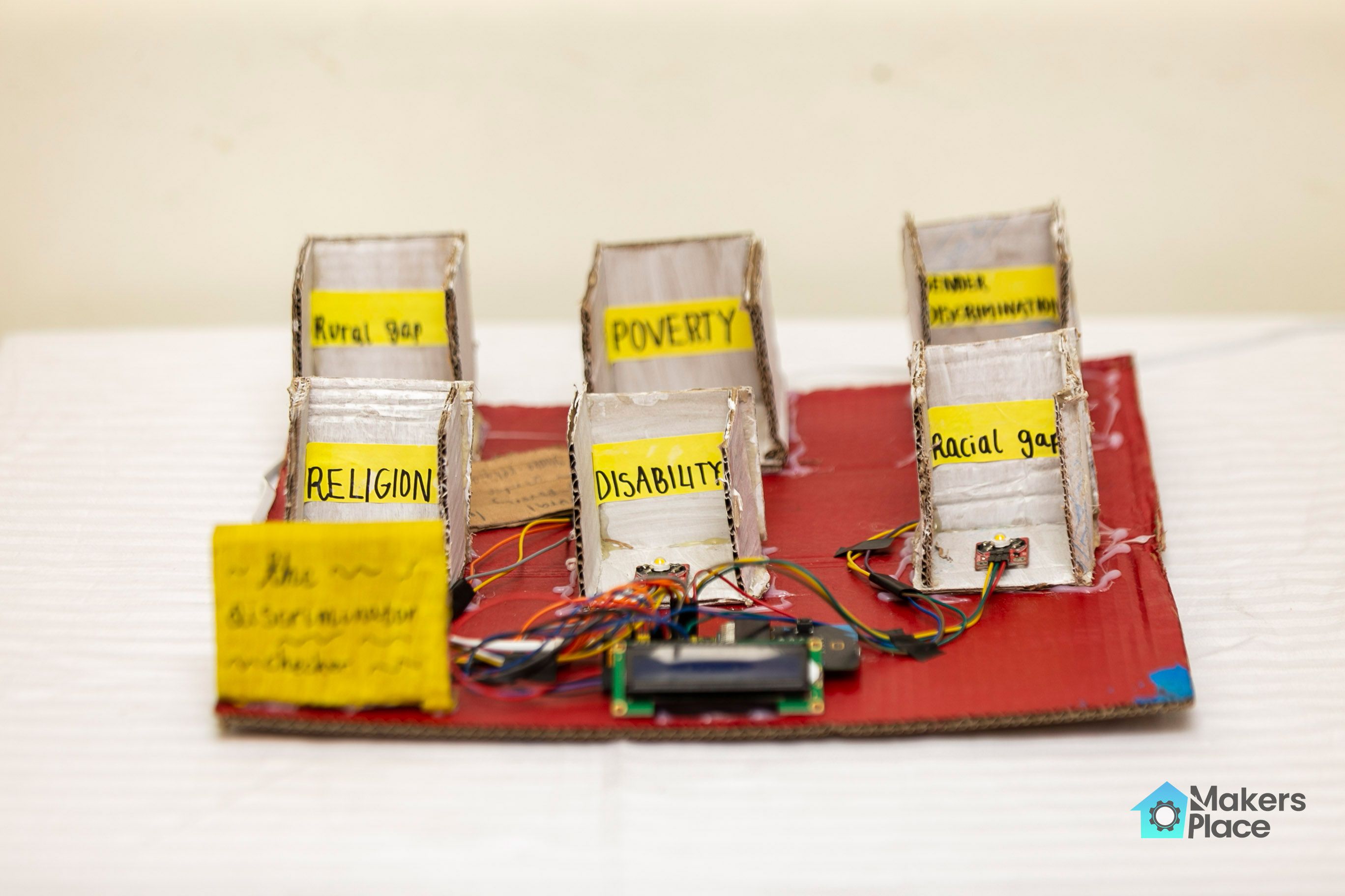 Close up photograph of micro:bit being used in the Discrimination Checker project.