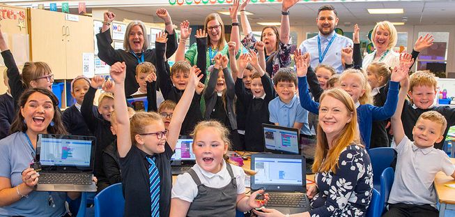 children celebrating their new micro:bits in a Scottish primary school