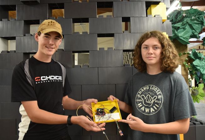Dawsen and Mason with their device