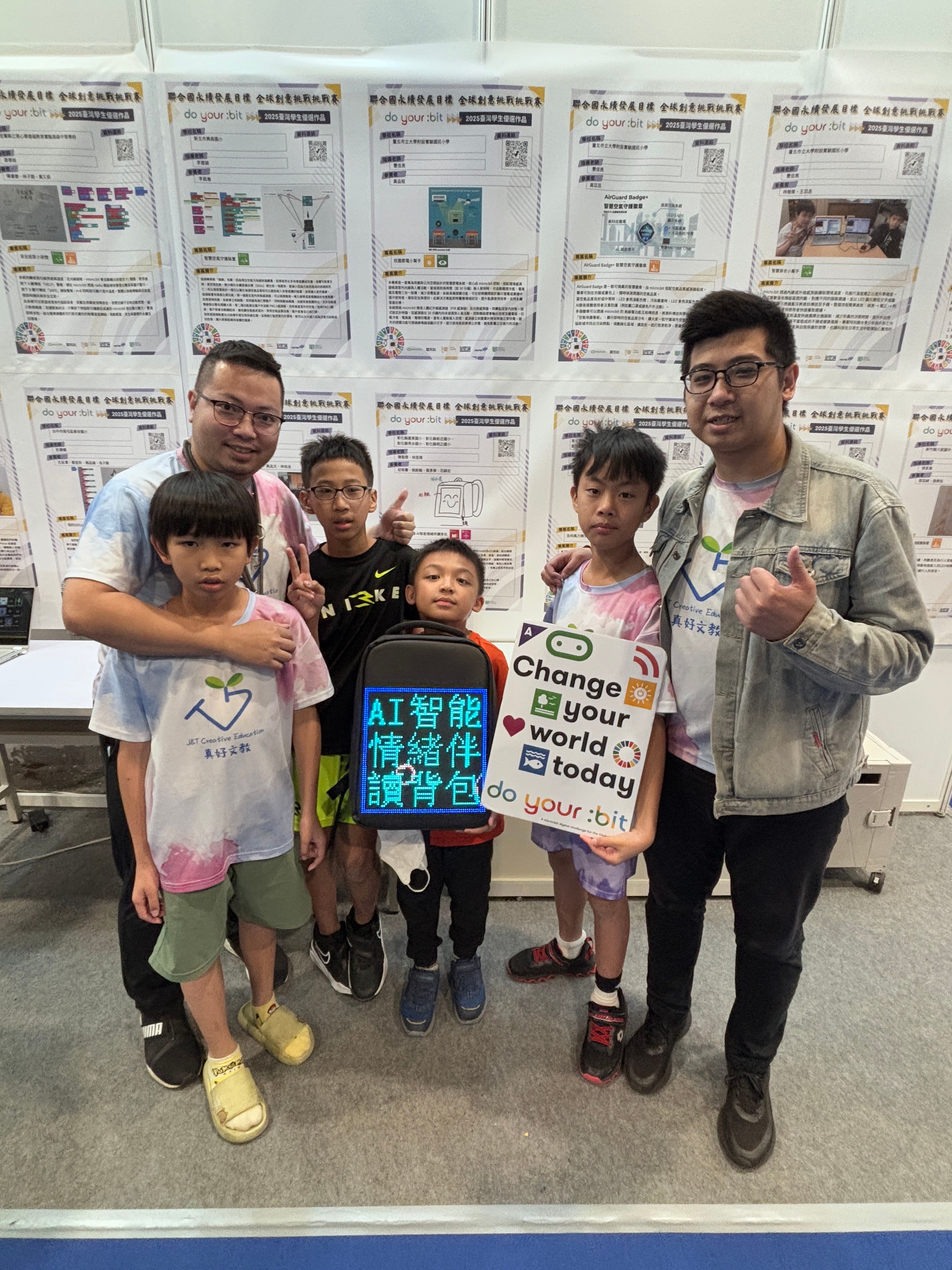 Students pose with their presentation posters.