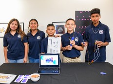 Students pose with a prototype of their project.