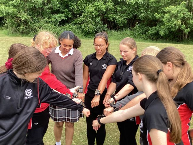 Students at Thornton College play a game of Red Light, Green Light using micro:bits