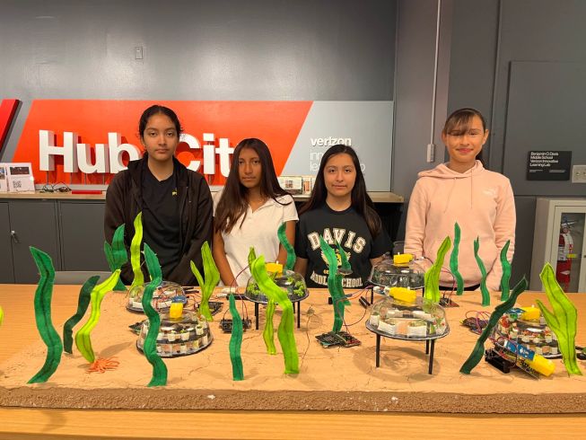 The Regenerative Ocean Farm team of 4 girls, displaying their micro:bit project