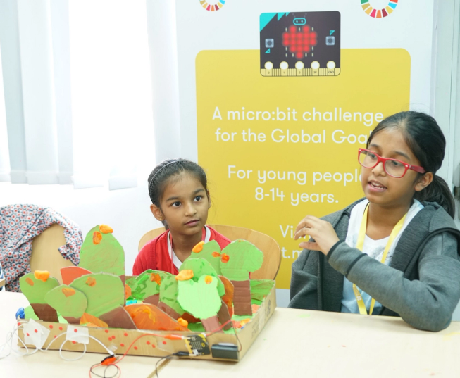 a young girl with her micro:bit invention