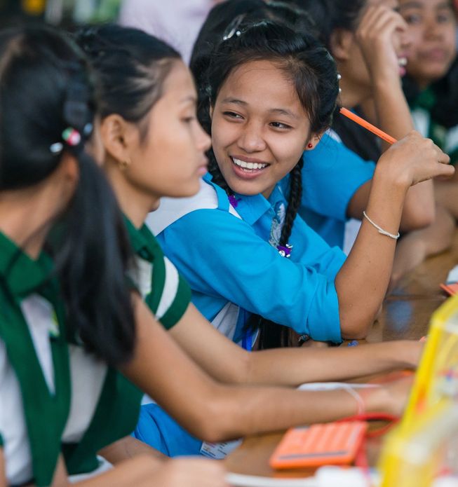 Girls sitting together at desks