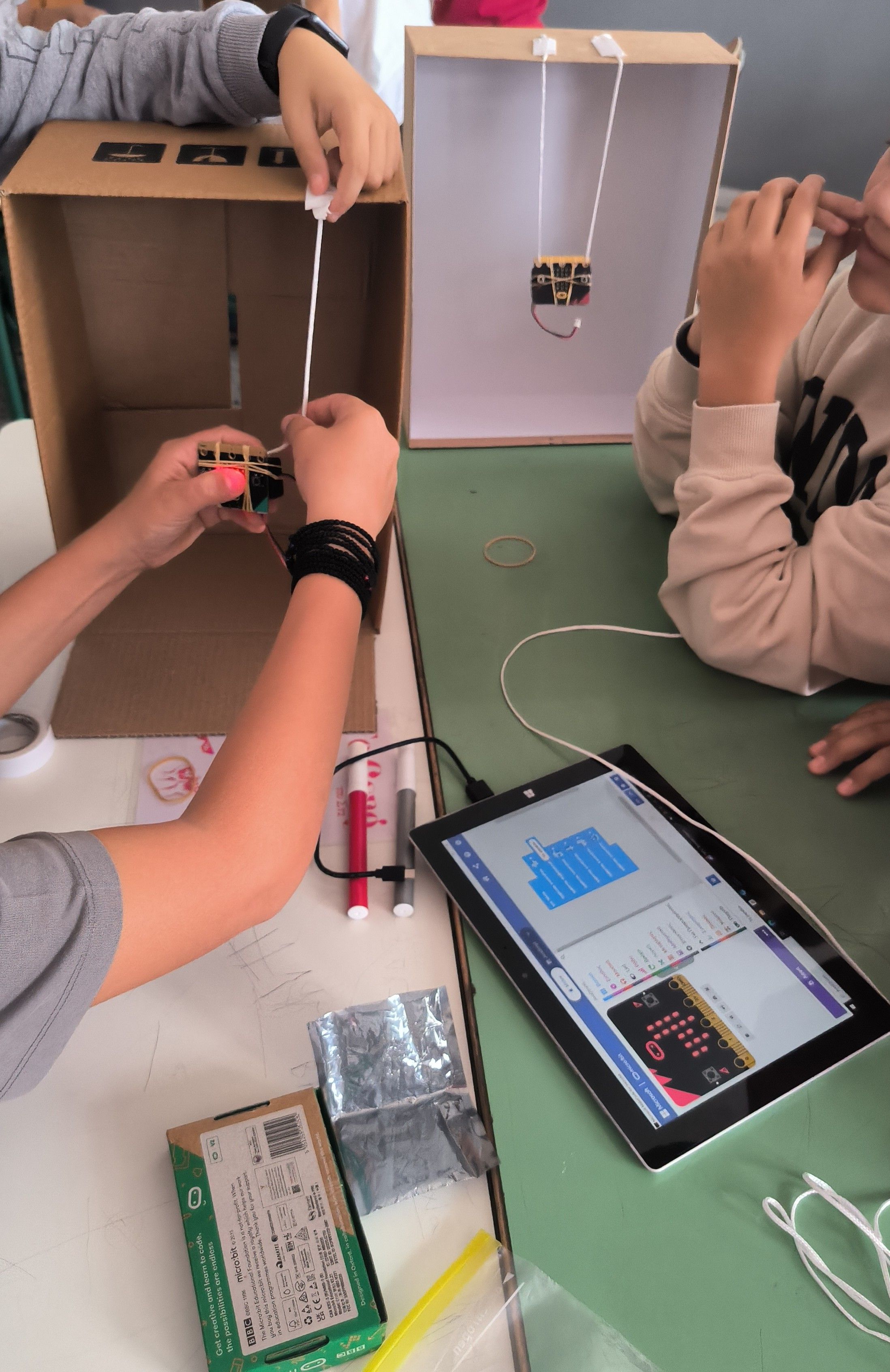 Close up of students working on their project prototype.