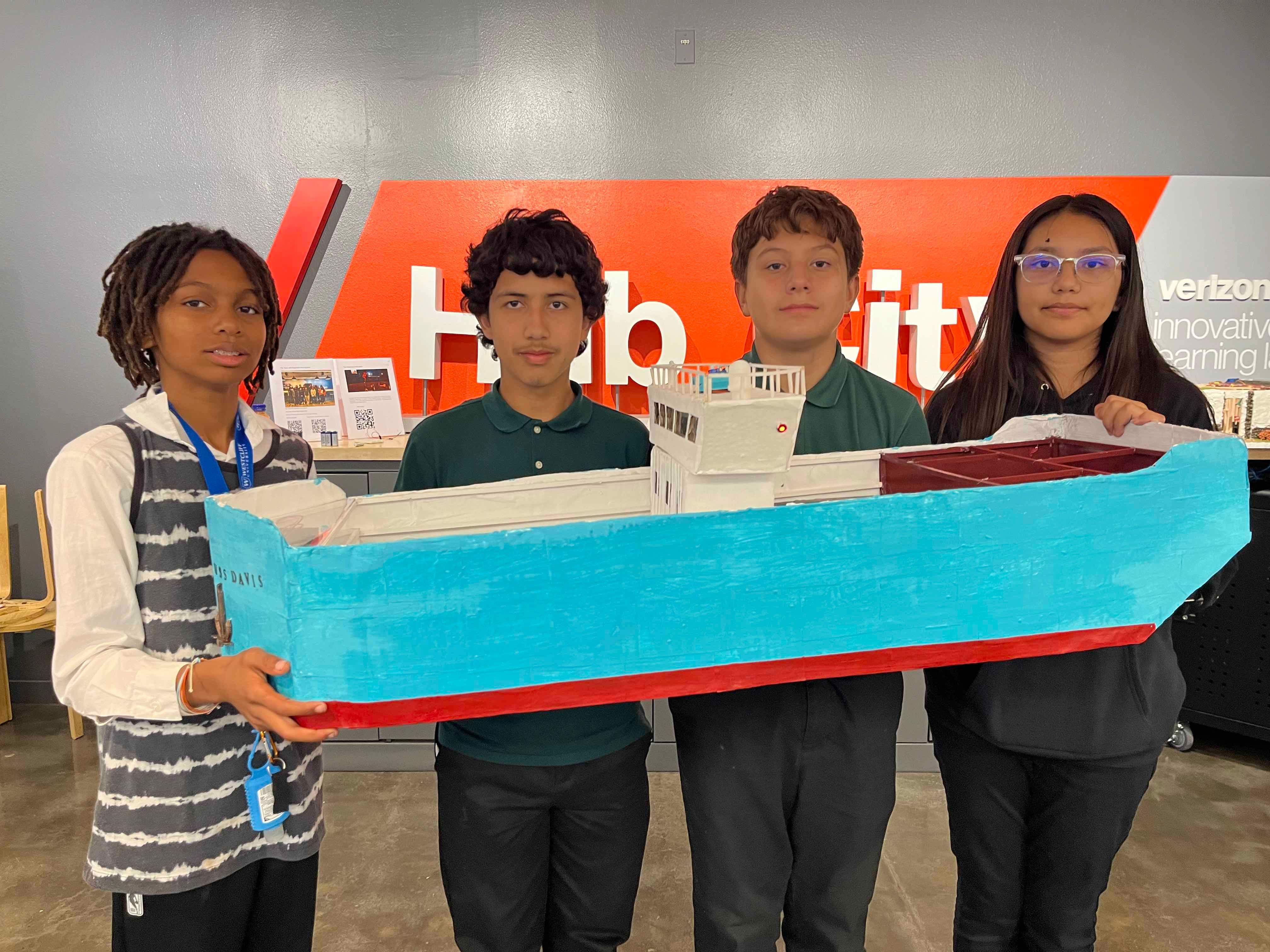 Students pose with their Aquaponics Ship prototype.