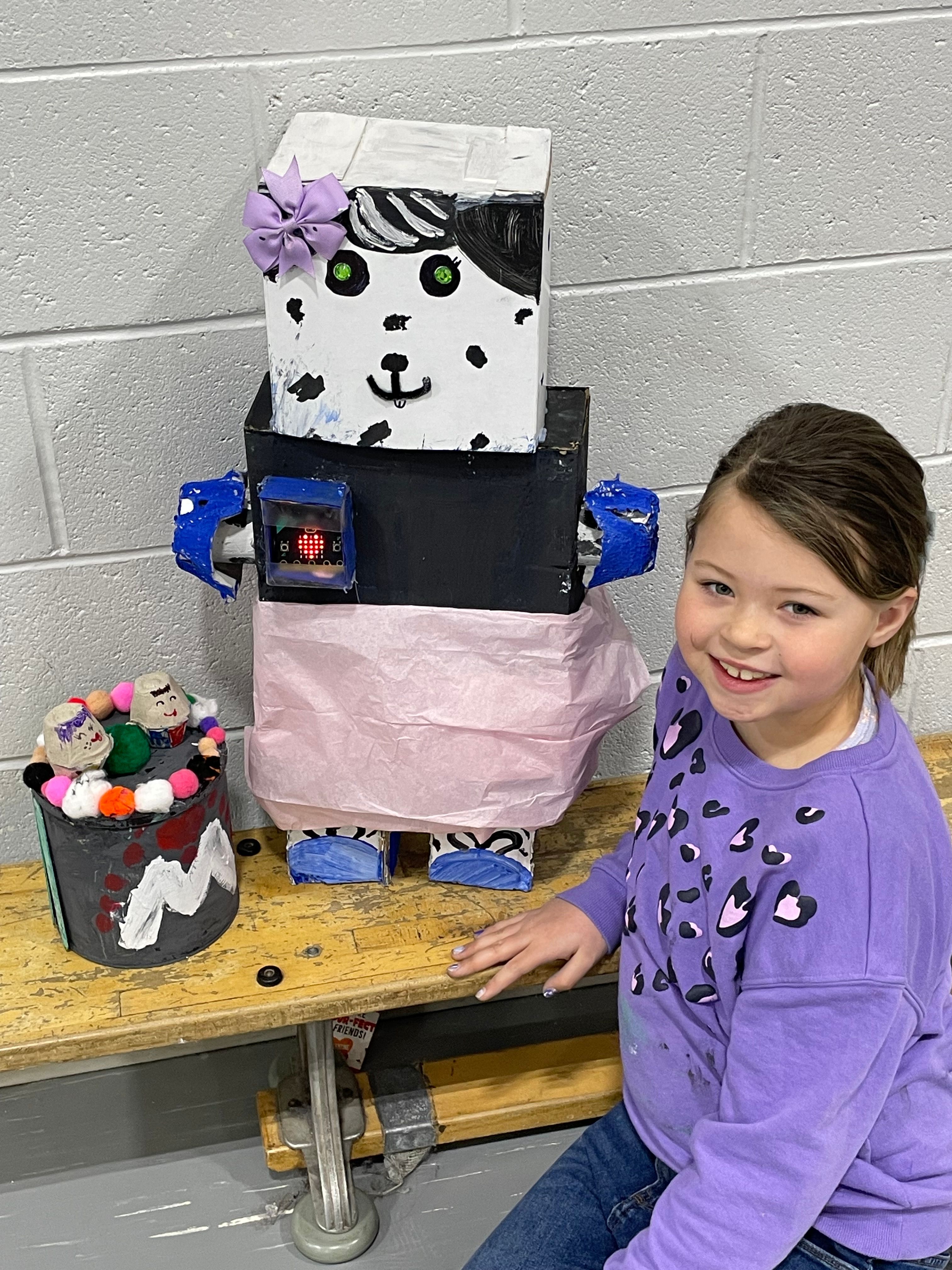 Student poses with her Bot.