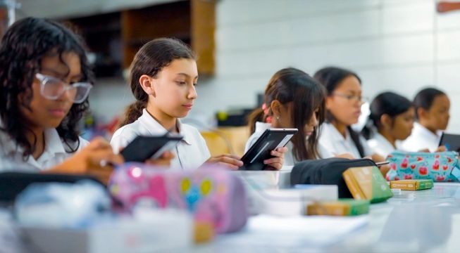 Female students at a Tinkering with Tech and AI workshop in Honduras