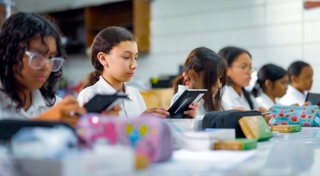Female students at a Tinkering with Tech and AI workshop in Honduras