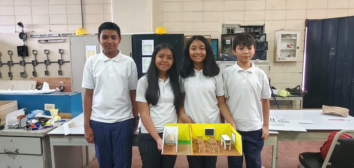 Students pose with a prototype of the CODEnat System.