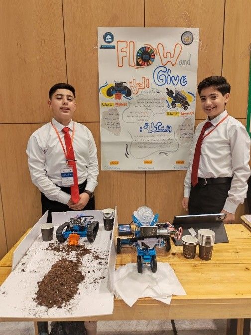 Students present a poster and prototype of their project.