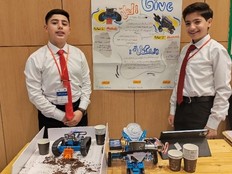 Students present a poster and prototype of their project.