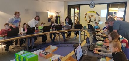 children working with micro:bit at the library