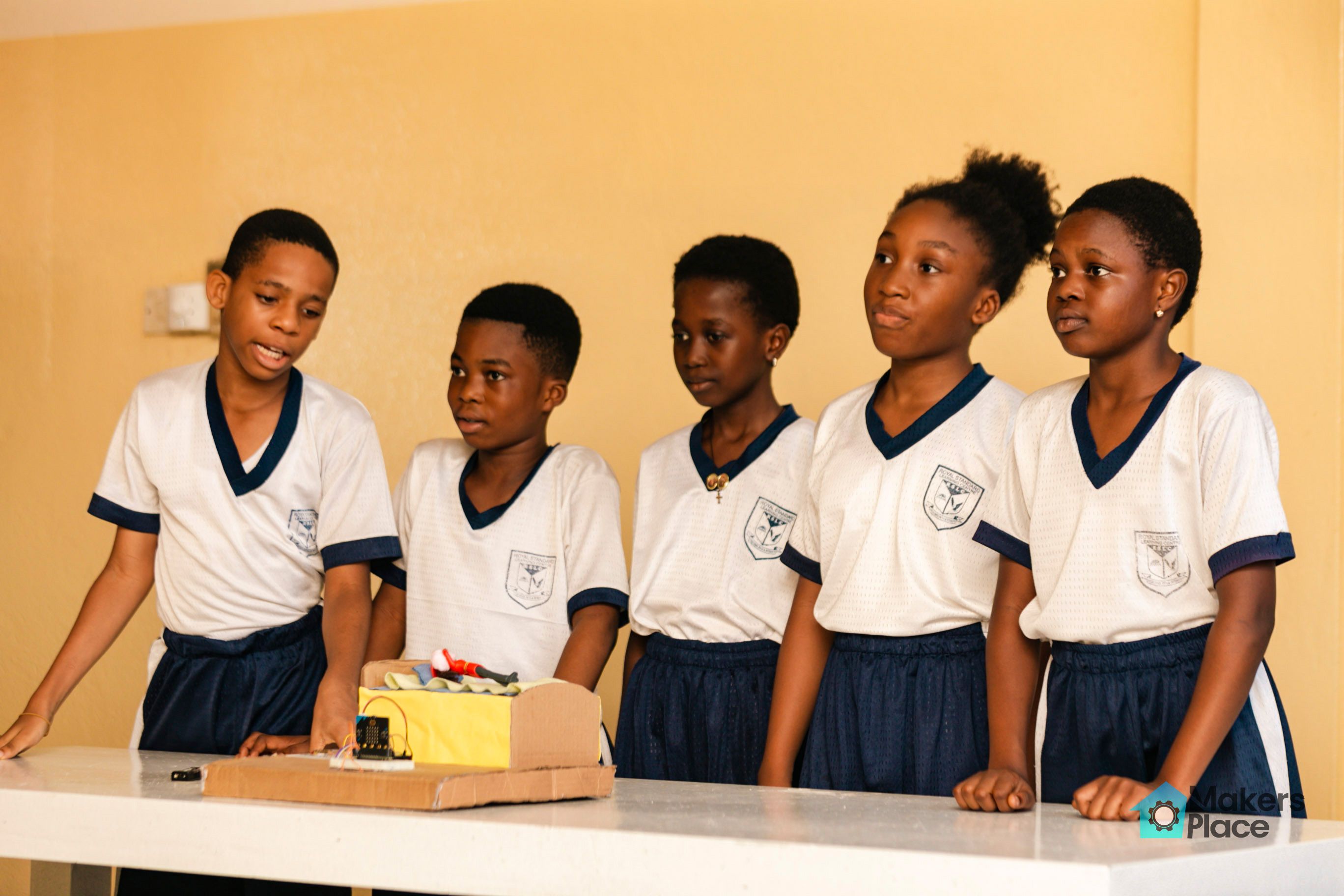 Students with earthquake life saver bed project.